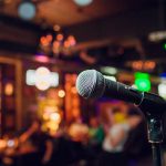 modern-microphone-singing-against-beautiful-blurry-colored-bokeh_152904-5849