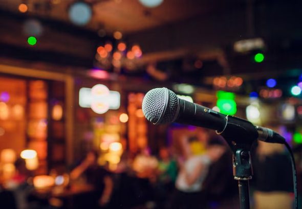 modern-microphone-singing-against-beautiful-blurry-colored-bokeh_152904-5849
