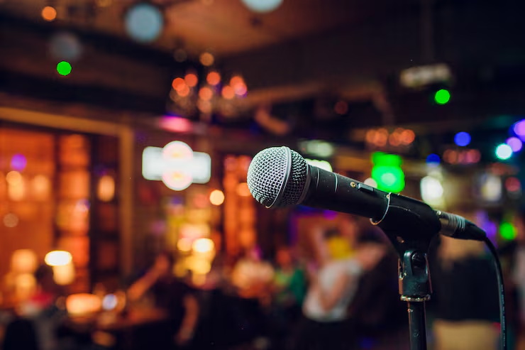 modern-microphone-singing-against-beautiful-blurry-colored-bokeh_152904-5849